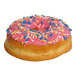 A donut ring with pink icing and colorful sprinkles.