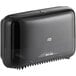 A black Tork Elevation OptiServe coreless high-capacity double roll toilet tissue dispenser.