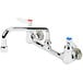 A T&S chrome wall mount faucet with two handles and adjustable centers.