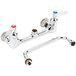 A T&S chrome wall mount mixing faucet with two handles.