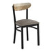 A black metal chair with a dark gray vinyl seat and a driftwood-finished wooden backrest.