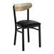 A black metal chair with a black vinyl seat and a driftwood-finished wooden backrest.