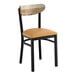 A black metal chair with a light brown vinyl seat and a driftwood-finished wooden backrest.
