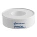 A roll of First Aid Only 1/2 inch by 5 yard waterproof adhesive tape in a white plastic dispenser.