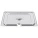 A Vollrath stainless steel slotted cover on a metal tray.