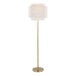 A gold floor lamp with an off-white linen tiered shade.
