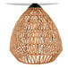 A natural rattan table lamp with a geometric woven base and a white linen drum shade.