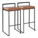 A pair of black metal barstools with low backs and camel-colored faux leather seats.