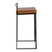 A modern barstool with a black metal frame and a camel faux leather seat.