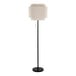 A black floor lamp with a beige linen tiered shade.