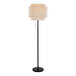 A black floor lamp with a beige linen tiered shade.