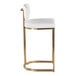 A modern barstool with a gold metal frame and white faux leather seat and backrest.