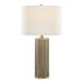A table lamp with an antique brass octagonal base and a white linen drum shade.