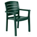 A close-up of a Grosfillex green plastic armchair with armrests.