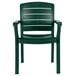 A case of 12 green Grosfillex Acadia stacking resin armchairs with white background.