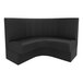 A large, black, curved booth seat with vertical channel stitching and a high backrest.