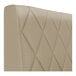 A beige diamond-tufted upholstered booth backrest.