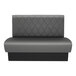 A graphite-colored, diamond-tufted double back booth with a 42-inch high backrest and a simple, modern design.