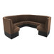 A large brown diamond-tufted three-quarter circle booth with high backrest and black base.