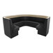 A large, curved black and beige upholstered booth with high backrests and a partial circular design.