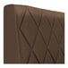 A brown diamond-tufted upholstered booth backrest.