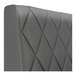 A graphite-colored, diamond-tufted double back booth with a smooth, upholstered finish.