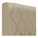 A beige diamond-tufted upholstered booth backrest.