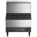 A stainless steel undercounter ice machine with a front air intake and black accents.