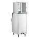 A commercial stainless steel ice machine with a storage bin.