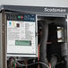 A Scotsman Prodigy Elite Series air-cooled medium cube ice machine with dispenser and Vari-Smart ice level control kit.