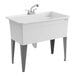 A large white polypropylene utility laundry tub sink with steel legs and a chrome faucet kit.