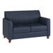 A navy blue loveseat with wooden feet and a modern design.