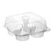 A clear plastic hinged container with four compartments and a high dome lid for holding cupcakes or muffins.