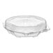 A clear plastic hinged pie container with a low dome lid.