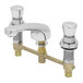 A T&S chrome metering faucet with two brass valves and push button caps.