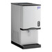 A stainless steel countertop nugget ice maker and dispenser with a lever dispensing system.