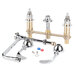 A chrome T&S deck-mount faucet with gooseneck and wrist action handles.