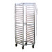 A clear heavy-duty vinyl cover fitted over a tall metal sheet pan rack on wheels.