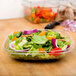 A salad in a clear plastic Sabert bowl.