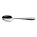 A stainless steel demitasse spoon with a textured handle.