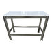 A stainless steel table with a white poly top and paw print footing.