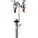 A T&S chrome deck mount faucet with 4 arm handles.
