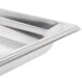 A Vollrath stainless steel table pan with perforations on a white surface.