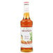 A bottle of Monin Premium Butter Pecan Flavoring Syrup, 750 mL.