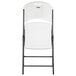 A white Lifetime folding chair with a black frame.