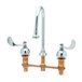 A T&S deck-mount faucet with two gooseneck handles.