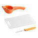 A white plastic Choice bar size cutting board with a knife and orange peeler.