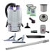 A cordless backpack vacuum cleaner kit with various attachments and accessories, including hard surface and carpet tools, filters, and a battery charger.