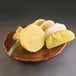 A plate with yellow lemon wedges on it.