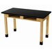 A black science lab table with wooden legs and a black phenolic top.